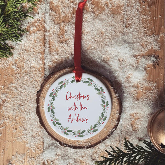 Christmas with the, family Christmas bauble with Holly wreath. Green, red and white Christmas decoration